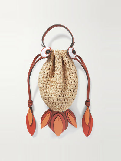 Anya Hindmarch Goldfish leather-trimmed embroidered raffia shoulder bag at Collagerie