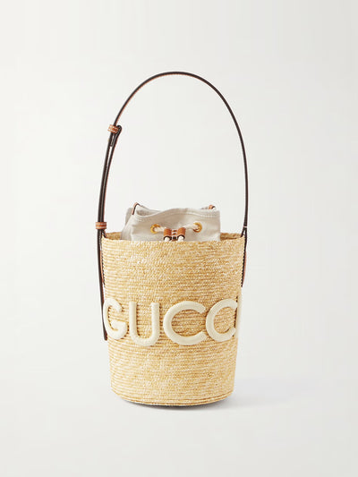 Gucci Leather-trimmed appliquéd raffia bucket bag at Collagerie