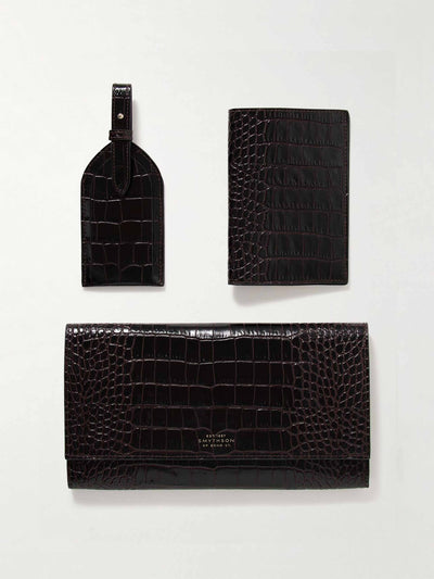 Smythson Mara croc-effect leather clutch, passport holder and luggage tag set at Collagerie