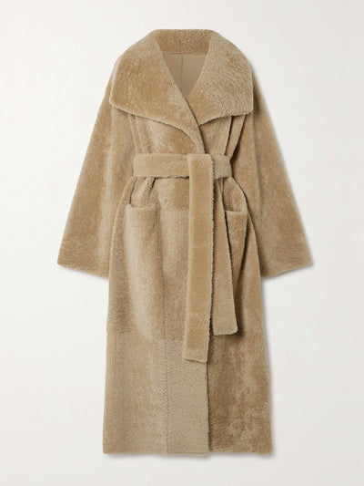 Totême Belted shearling coat at Collagerie