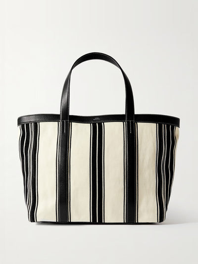 Totême Large leather-trimmed striped canvas tote at Collagerie