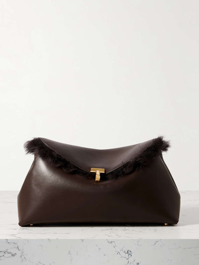 Totême T-Lock shearling clutch at Collagerie