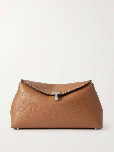 Totême T-Lock textured-leather clutch at Collagerie