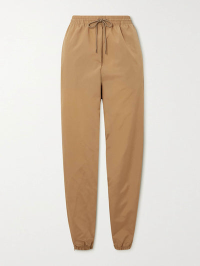 wardrobe.nyc Tan shell tapered track pants at Collagerie