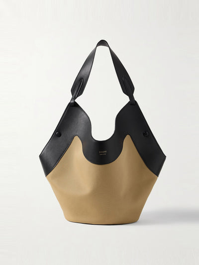 Khaite Lotus medium leather-trimmed canvas tote at Collagerie