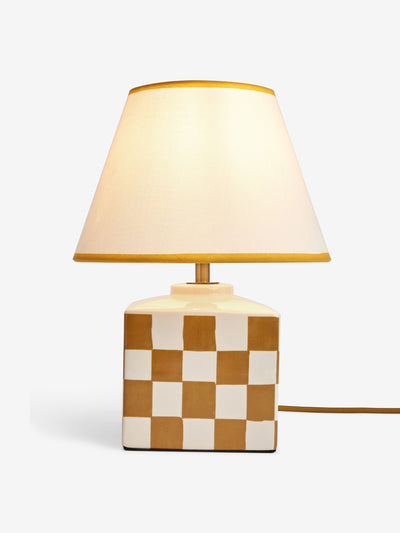 Next Ochre yellow chequer table lamp at Collagerie