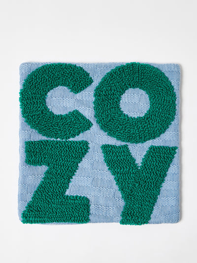 Oliver Bonas Cozy blue knitted cushion cover at Collagerie