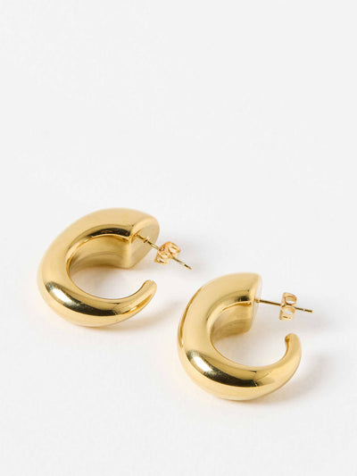 Oliver Bonas Dalcon curved gold tone chunky hoop earrings at Collagerie