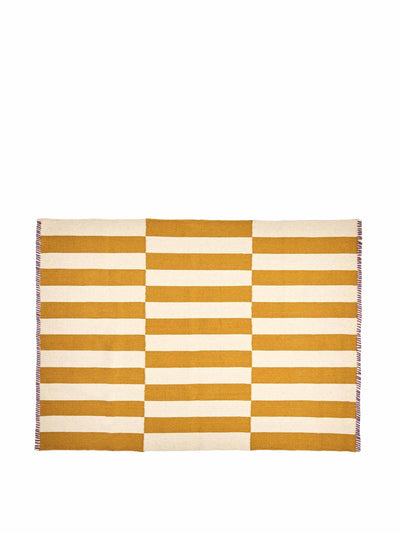 Oliver Bonas Simeon handwoven striped yellow wool & cotton rug at Collagerie