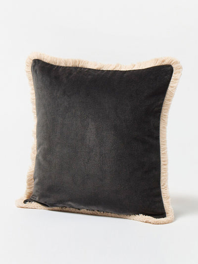 Oliver Bonas Issey black velvet fringed cushion cover at Collagerie