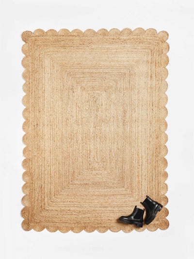 Oliver Bonas Scalloped natural brown jute rug at Collagerie