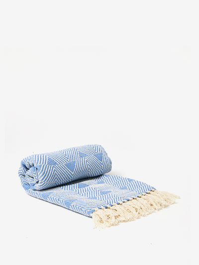 Oliver Bonas Niru woven blue geometric throw at Collagerie