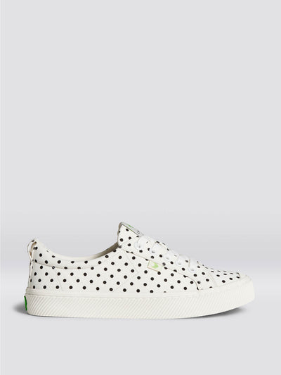 Cariuma Oca Low white polka dot canvas trainers at Collagerie