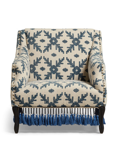 Oka Tarma tasselled armchair in Lazaret blue at Collagerie