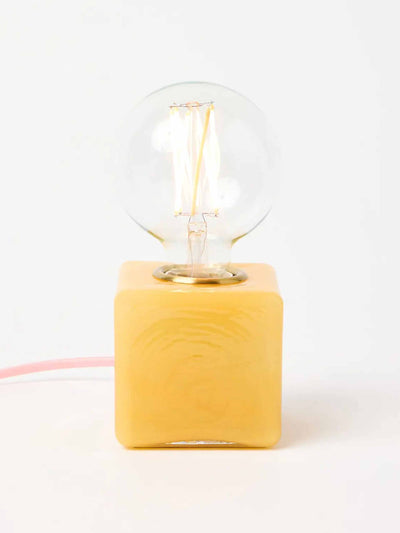 Oliver Bonas Alina yellow glass rectangular desk and table lamp at Collagerie