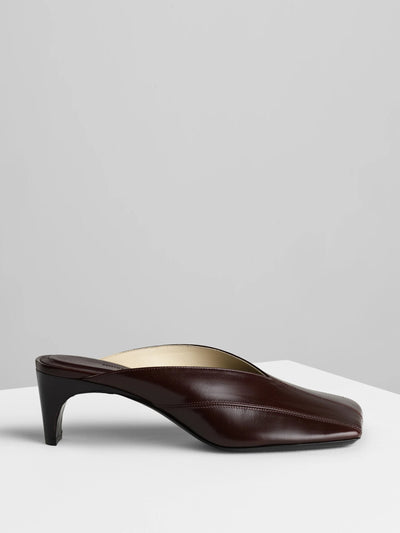 Phoebe Philo Tilt mules in oxblood leather at Collagerie