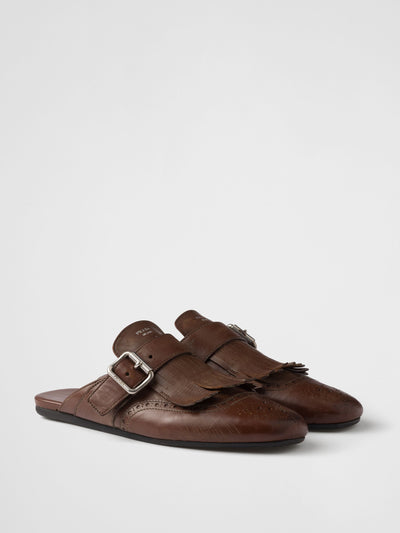 Prada Shuffle fringed leather mules at Collagerie