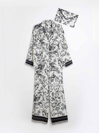 River Island Black satin floral toile print pyjama set at Collagerie