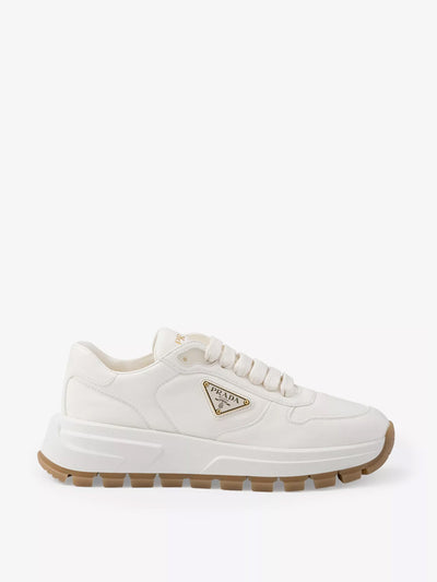 Prada Brand-plaque leather low-top trainers at Collagerie