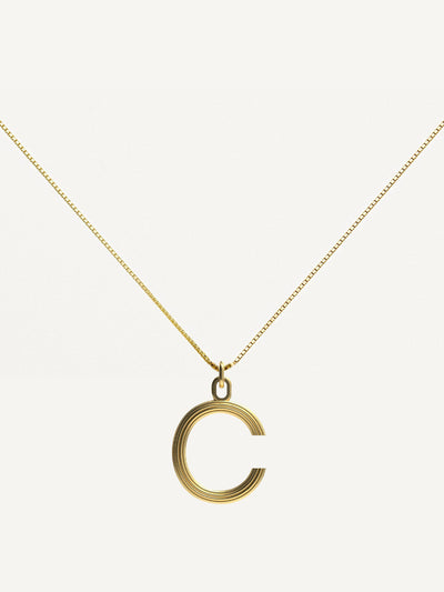 Dévé Small gold Alphabet necklace at Collagerie