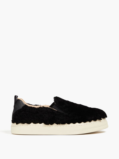 Chloé Shearling slip-on sneakers at Collagerie