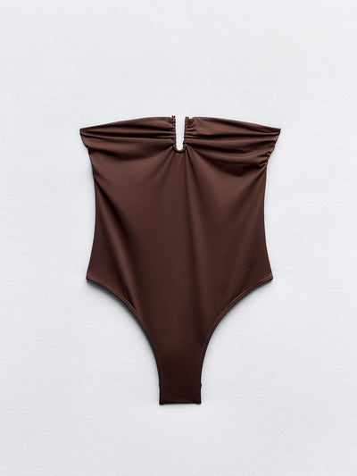 Zara Swimsuit with a bandeau neckline and metal piece at Collagerie