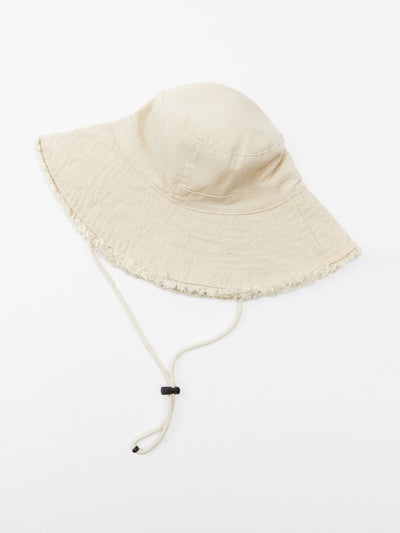 Zara Ivory frayed bucket hat with drawstrings at Collagerie