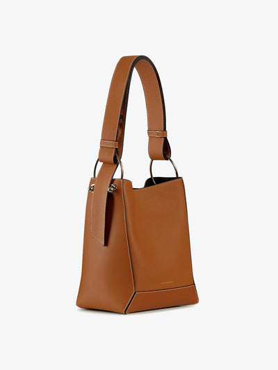 Strathberry Lana Midi bucket bag in tan leather with white stitching at Collagerie