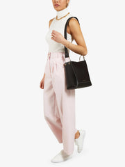 The perfect everyday Strathberry leather bucket bag, made large enough to carry necessities. Adjustable wide leather shoulder and crossbody strap. Collagerie.com