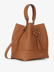 Wearable as a crossbody or carried in the hand, this leather Strathberry drawstring bucket bag is sized to fit all your everyday needs. Collagerie.com