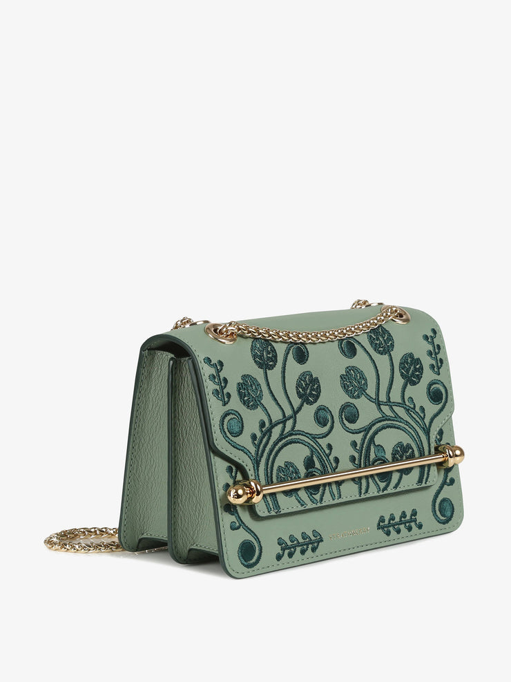 A chic Strathberry mini bag, the perfect size to take you from day to evening wear, defined by the gold bar closure and adjustable gold chain strap. Collagerie.com