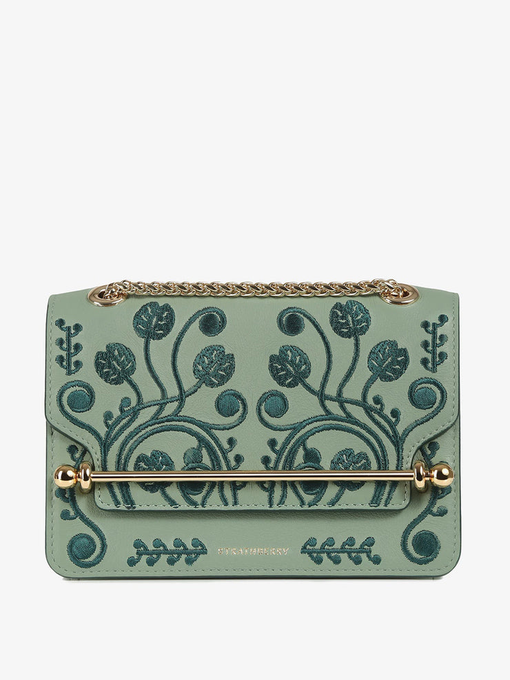 A chic Strathberry mini bag, the perfect size to take you from day to evening wear, defined by the gold bar closure and adjustable gold chain strap. Collagerie.com