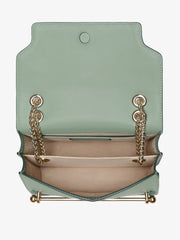 A chic Strathberry mini bag, the perfect size to take you from day to evening wear, defined by the gold bar closure and adjustable gold chain strap. Collagerie.com