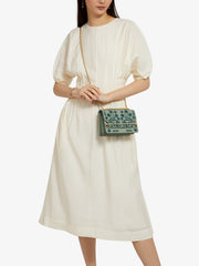 A chic Strathberry mini bag, the perfect size to take you from day to evening wear, defined by the gold bar closure and adjustable gold chain strap. Collagerie.com