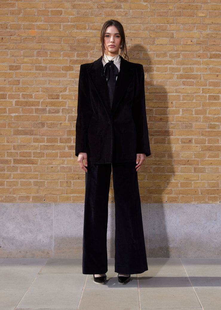 High-waisted wide leg black velvet Anna Mason trousers. The ideal goes-with-everything capsule wardrobe number. Collagerie.com