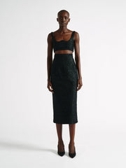 Sculpted from an elegant black guipure lace and finished with curved detail at the bust. With a wife-set neckline this is a key styling piece for AW22. Collagerie.com