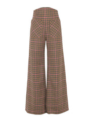 A classic trouser shape made from British check wool in cherry toffee with it’s wide-leg and high-waisted with patch pockets in the front by Anna Mason. Collagerie.com