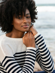 Cashmere navy and cream striped Henley jumper by Rae Feather. Shoulder button detail and extended length on the sleeves. Perfect with jeans or shorts | Collagerie.com