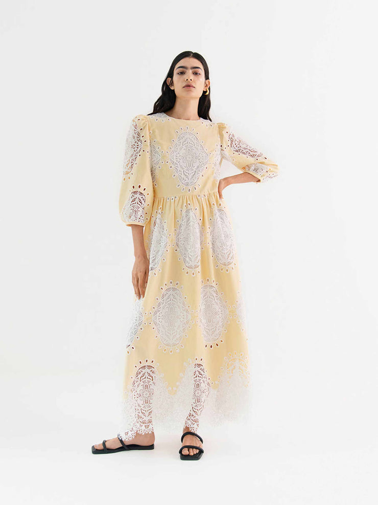 Constance white lace and yellow denim lace midi dress by Borgo de Nor. With its luxe white lace details, it is a party dress or a perfect summer dress | Collagerie.com