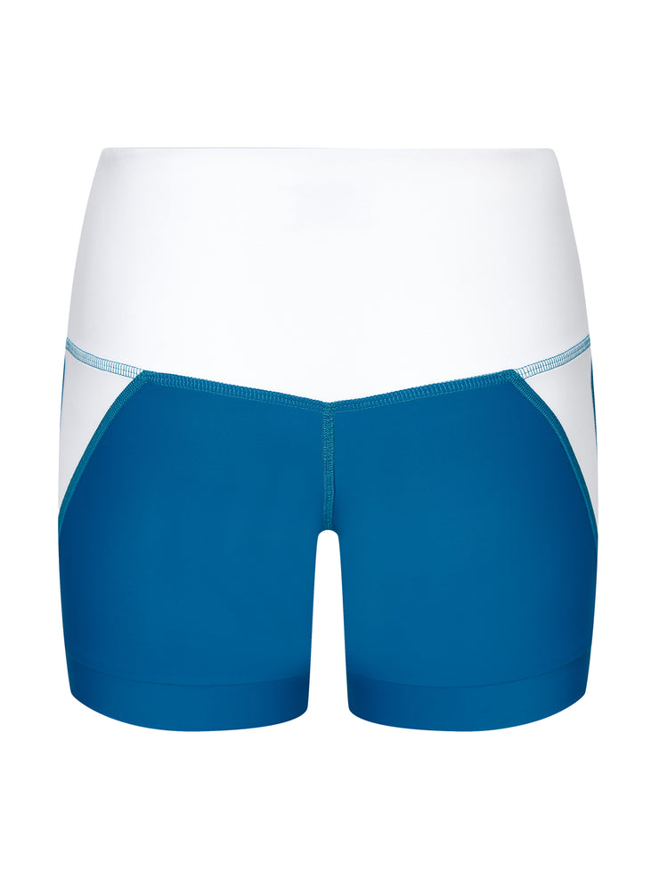 Luxe high waisted blue and white court tennis shorts with shaping trim by Exeat. Made with sustainable fabric using recycled ocean plastics | Collagerie.com