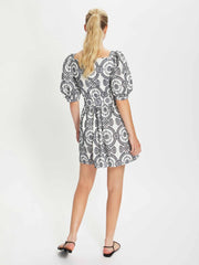 Dominique navy and white broderie anglaise mini dress by Borgo de Nor. Black and white print mini dress with puffed sleeves for the evening | Collagerie.com