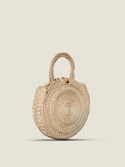 The Colombia Collective Laurita woven clutch bag at Collagerie