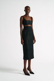 A defining silhouette for Emilia Wickstead, the Lorinda skirt is reinvented for AW22 in a sultry guipure lace. The classic pencil skirt silhouette. Collagerie.com