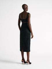 Sculpted from an elegant black guipure lace and finished with curved detail at the bust. With a wife-set neckline this is a key styling piece for AW22. Collagerie.com