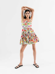 Freddie pink floral tiered cotton mini dress by Borgo de Nor. Square neckline dress with gathered mid-thigh skirt. Multi coloured floral print dress | Collagerie.com