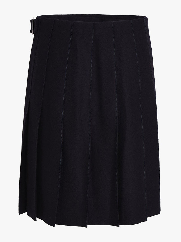The Kate navy blue skirt by Issue Twelve is knee length with kilt pleats and a wrap front. In a wool and recycled cashmere perfect for Autumn Winter. Collagerie.com