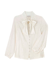 Cut from a fluid silk jacquard fabric, this chic silk Yolke blouse with a voluminous bow & elegantly tailored sleeves can be dressed up or down. Collagerie.com