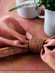 Set of two terracotta and mustard linen placemats and napkins