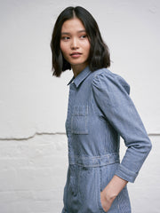 Relaxed fitting striped blue denim Seventy + Mochi jumpsuit with soft gathering at the back and a straight leg. The perfect transitional piece. Collagerie.com