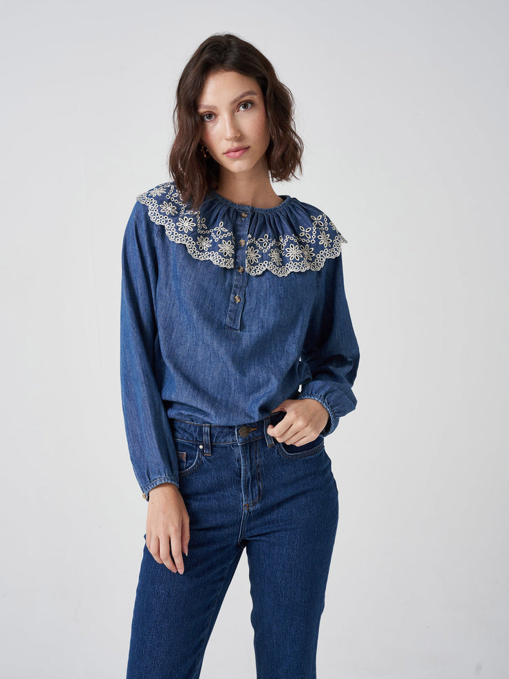 Featuring a statement collar, this versatile, denim Seventy + Mochi blouse is the perfect transitional piece. Layer under jumpers and jackets, or on its own. Collagerie.com